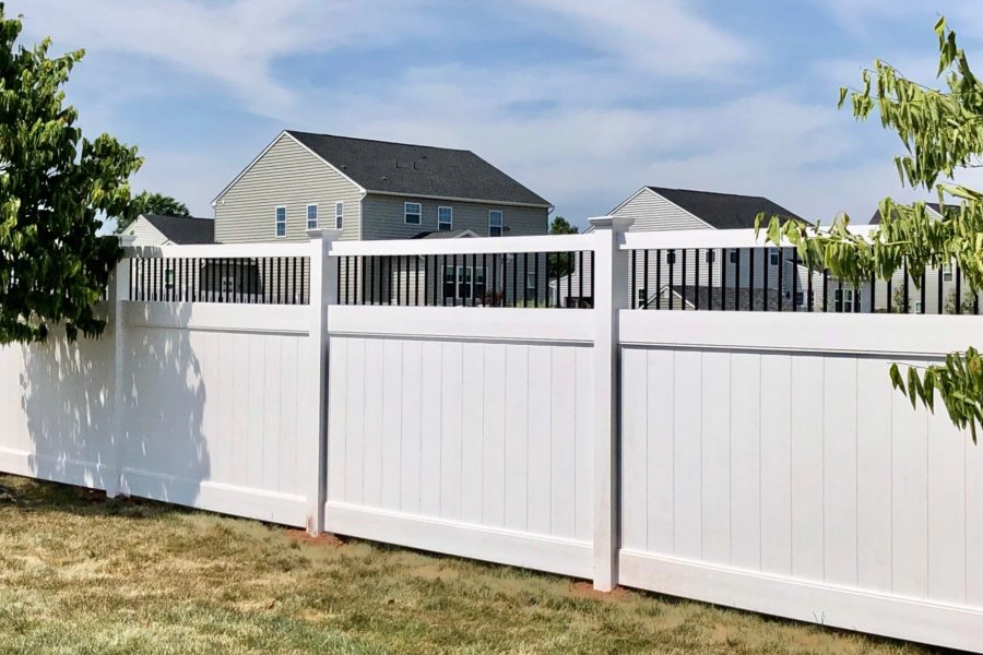 white vinyl fence of a house with houses behind and trees around grove city oh